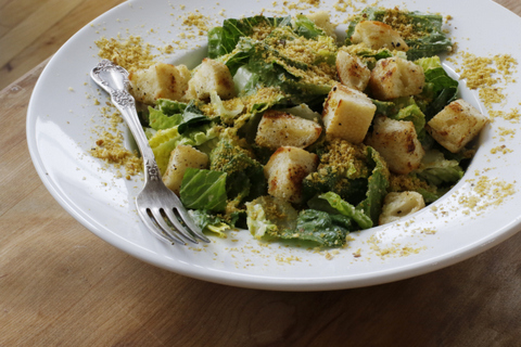 This March 28, 2016 photo shows a vegan Caesar salad in Concord, N.H. The combination of Japanese miso paste and nutritional yeast flakes mimics the rich, savory flavor this dish usually gets from anchovies and Parmesan cheese. (AP Photo/J.M. Hirsch)