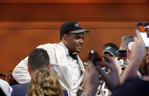 Notre Dames Ronnie Stanley celebrates after being selected by Baltimore Ravens as the sixth pick in the first round of the 2016 NFL football draft, Thursday, April 28, 2016, in Chicago. (AP Photo/Nam Y. Huh)