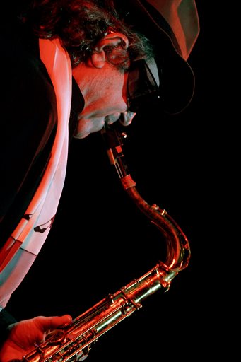 FILE - In this Friday, Sept. 15, 2006 file photo, Argentinian tenor saxophonist Gato Barbieri performs in Santo Domingo, Dominican Republic. On Saturday, April 2, 2016, the Grammy winning musician died in a New York hospital from pneumonia at the age of 83, his wife, Laura said. (AP Photo/Ramon Espinosa)