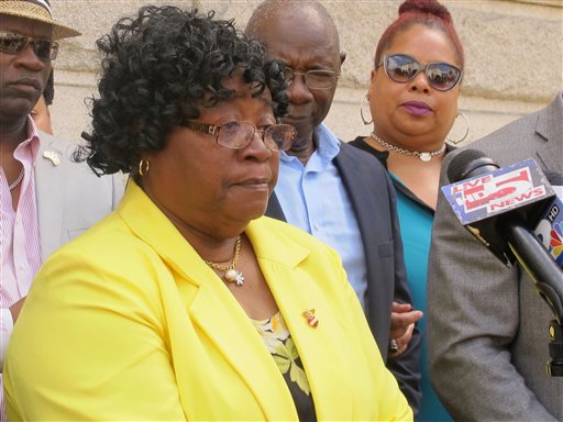 Judy Scott, the mother of Walter Scott who was shot and killed while fleeing a traffic stop in April of 2015, speaks to reporters outside the federal courthouse in Charleston, S.C., on Wednesday, May 11, 2016. Prosecutors on Wednesday unsealed an indictment charging white former police officer Michael Slager with three federal counts in the death of Scott. Slager already faces a murder charge in state court. (AP Photo/Bruce Smith)