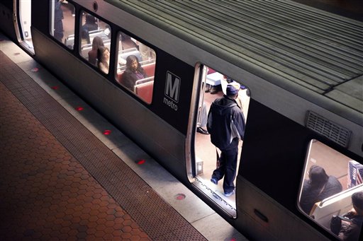 A rider enters a Metro train in the Gallery Place-Chinatown Metro station Tuesday, March 15, 2016 in Washington. The head of the rail system that serves the nation's capital and its Virginia and Maryland suburbs says the system will shut down for a full day after a fire near one of the system's tunnels. (AP Photo/Alex Brandon)
