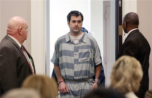 In a Thursday, Sept. 10, 2015 file photo, former North Charleston police office Michael Slager, is lead into court, in Charleston, S.C. A federal judge will decide whether Slager, charged with murder in the shooting death of an unarmed black motorist, can remain free on bond. An indictment unsealed Wednesday, May 11, 2016, shows that Slager is charged with violating Walter Scott's civil rights and two other federal charges. (Grace Beahm/The Post And Courier via AP) MANDATORY CREDIT