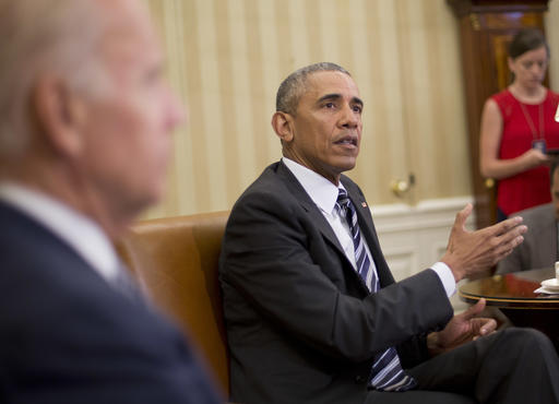 President Barack Obama, right, speaks to members of the media in the Oval Office of the White House in Washington, Monday, June 13, 2016, after getting briefed on the investigation of a shooting at a nightclub in Orlando by FBI Director James Comey, Homeland Security Secretary Jeh Johnson, and other officials.  With Obama is Vice President Joe Biden, left. (AP Photo/Pablo Martinez Monsivais)