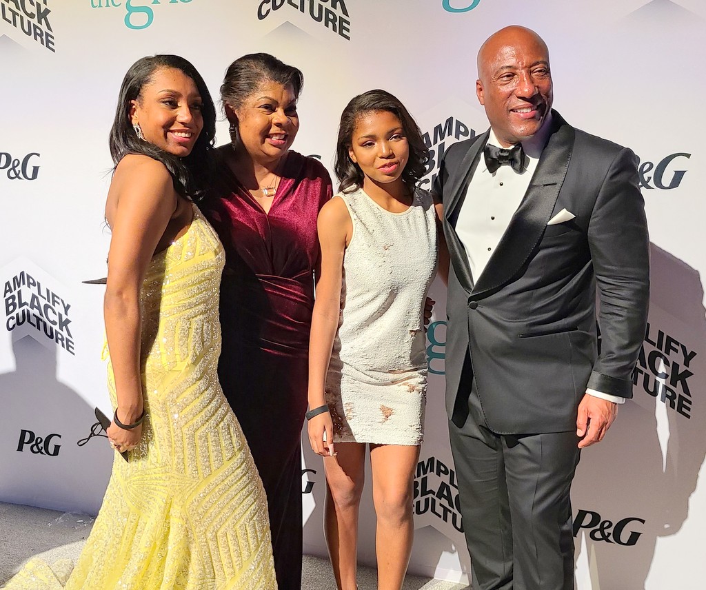 April Ryan (center) and daughters share a moment with Byron Allen